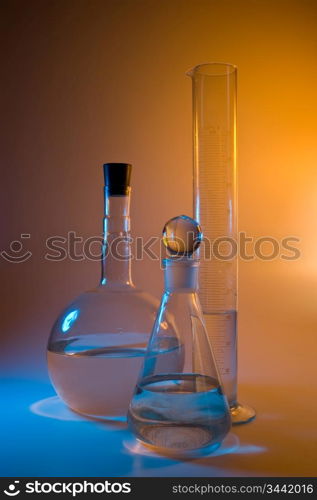 chemical glassware in multicolored lights