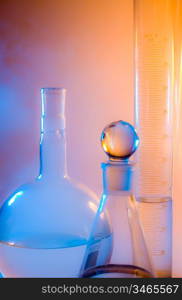 chemical glassware in multicolored lights