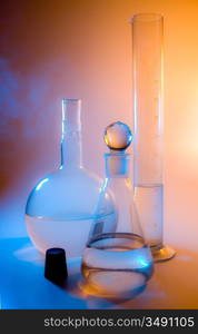 chemical glassware in multicolored lights