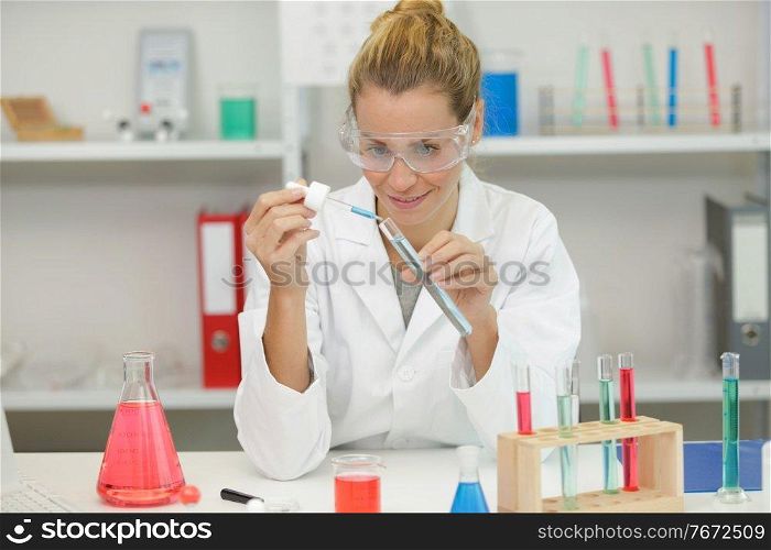 chemical laboratory scientist woman working with pipette