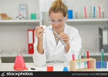 chemical laboratory scientist woman working with pipette