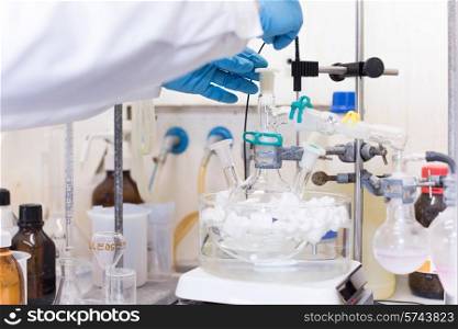 Chemical scientist working in modern biological laboratory