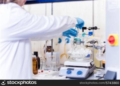 Chemical scientist working in modern biological laboratory