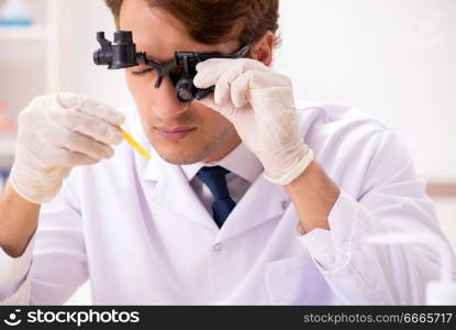 Chemist in the lab checking with ph strips
