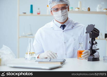 Chemist mixing perfumes in the lab