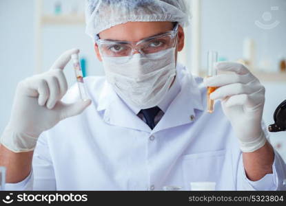 Chemist mixing perfumes in the lab