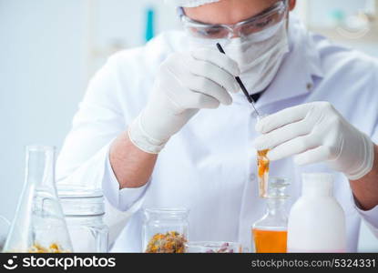 Chemist mixing perfumes in the lab