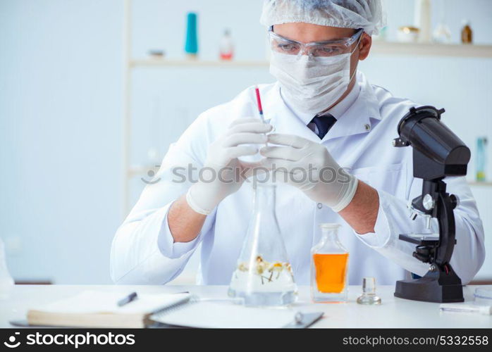 Chemist mixing perfumes in the lab