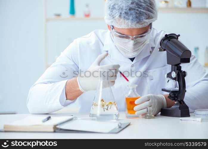 Chemist mixing perfumes in the lab