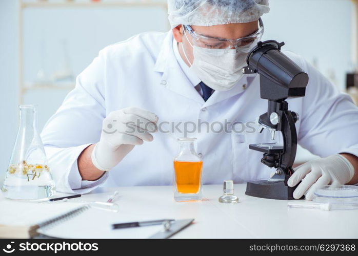 Chemist mixing perfumes in the lab