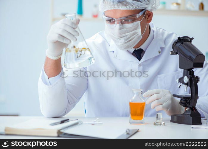 Chemist mixing perfumes in the lab