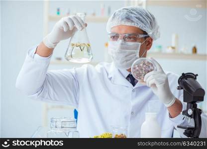 Chemist mixing perfumes in the lab