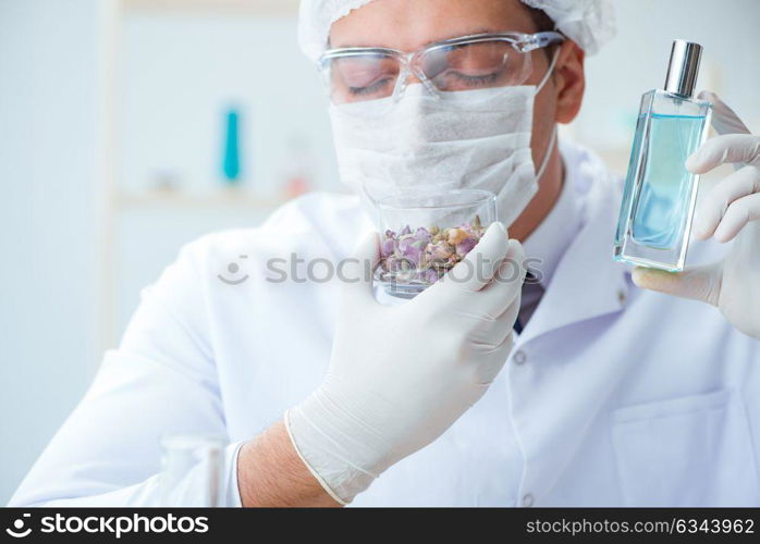 Chemist mixing perfumes in the lab