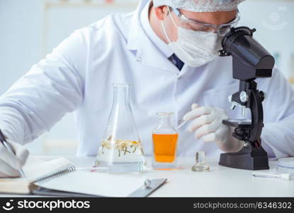 Chemist mixing perfumes in the lab