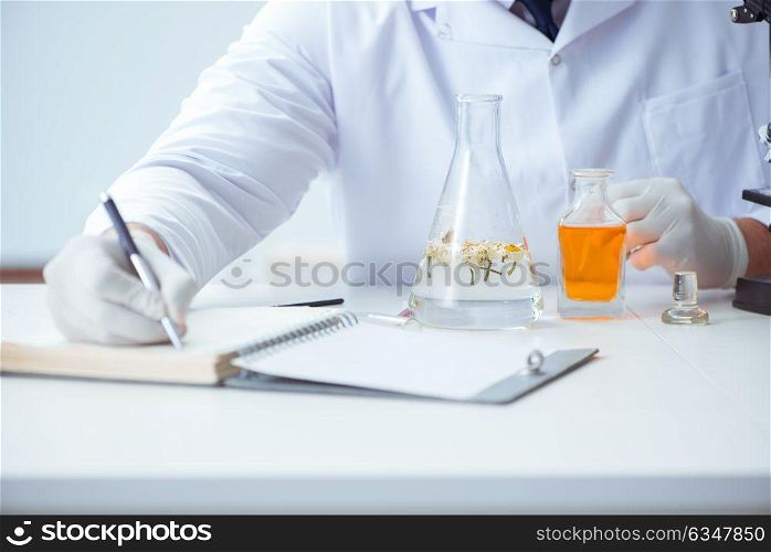 Chemist mixing perfumes in the lab