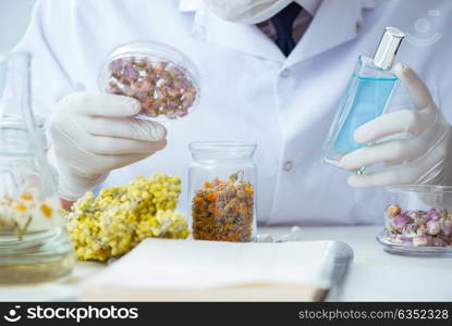 Chemist mixing perfumes in the lab