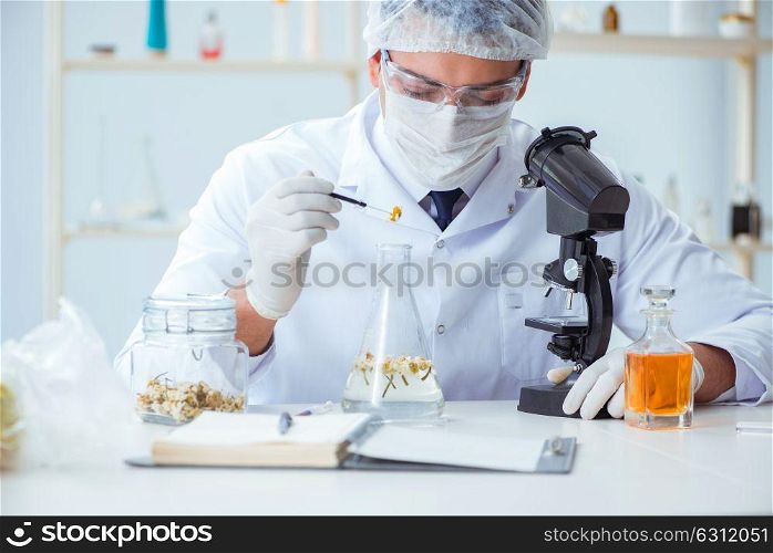 Chemist mixing perfumes in the lab. The chemist mixing perfumes in the lab