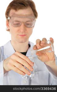 Chemist pours liquid from one flask in another