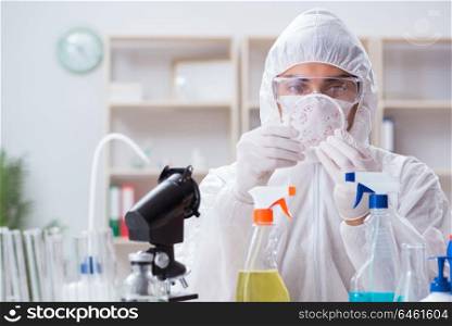 Chemist testing chemical substances in lab