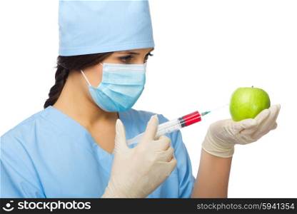 Chemist with syringe and apple isolated on white