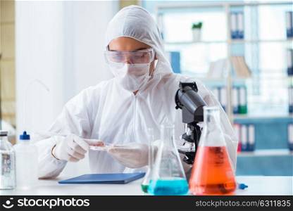 Chemist working in the lab. The chemist working in the lab