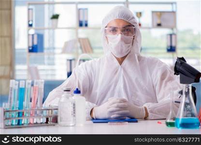 Chemist working in the lab. The chemist working in the lab