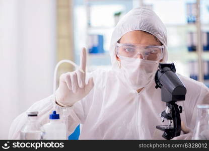 Chemist working in the laboratory with hazardous chemicals. The chemist working in the laboratory with hazardous chemicals