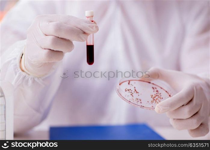 Chemist working in the laboratory with hazardous chemicals