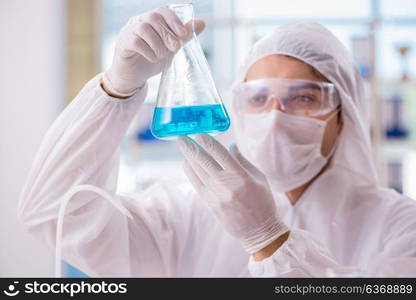 Chemist working in the laboratory with hazardous chemicals