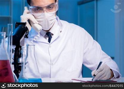 Chemistry assistant working in the chemical lab