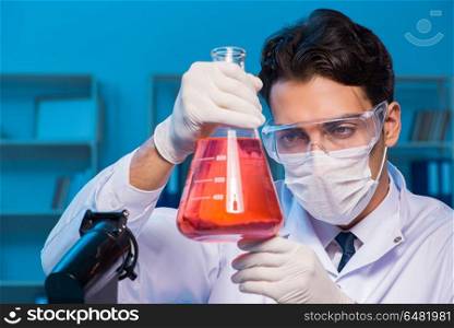 Chemistry assistant working in the chemical lab