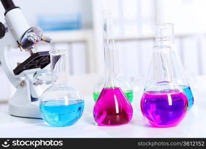 Chemistry laboratory glassware with colour liquids in them