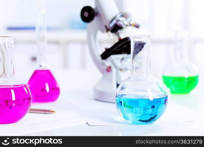 Chemistry laboratory glassware with colour liquids in them