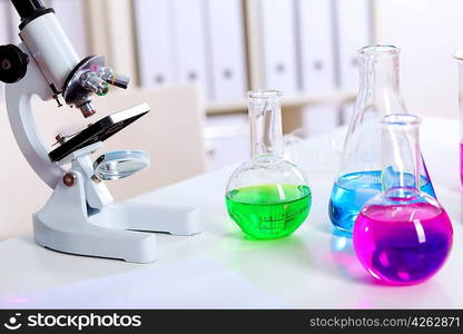 Chemistry laboratory glassware with colour liquids in them