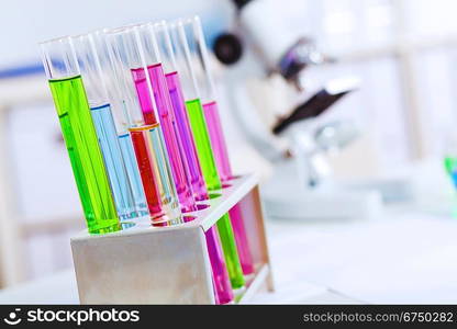 Chemistry laboratory glassware with colour liquids in them