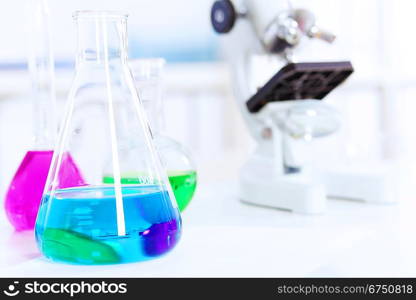 Chemistry laboratory glassware with colour liquids in them