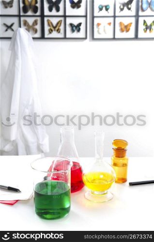 chemistry laboratory tubes butterflies background