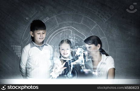 Chemistry lesson. Young teacher and her pupils doing tests lesson