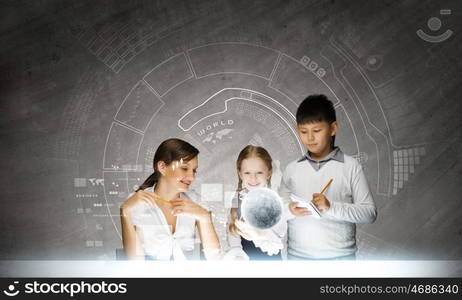 Chemistry lesson. Young teacher and her pupils doing tests lesson