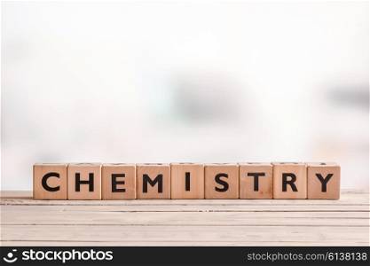Chemistry sign on a wooden table in a room