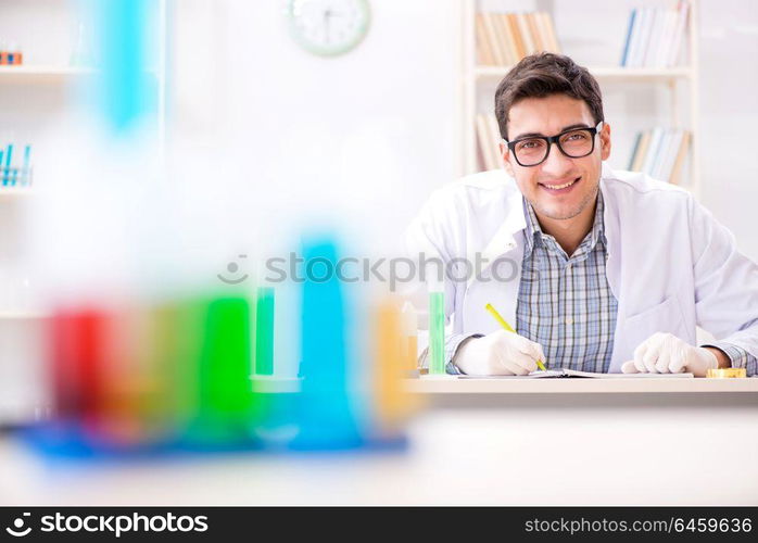 Chemistry student doing chemical experiments at classroom activity. Chemistry student doing chemical experiments at classroom activi