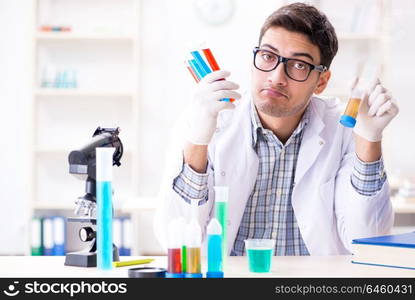 Chemistry student doing chemical experiments at classroom activity. Chemistry student doing chemical experiments at classroom activi