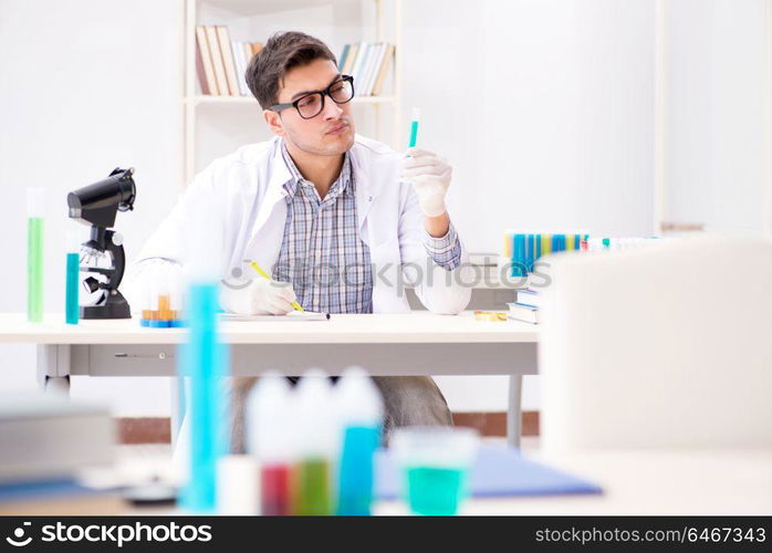 Chemistry student doing chemical experiments at classroom activity. Chemistry student doing chemical experiments at classroom activi