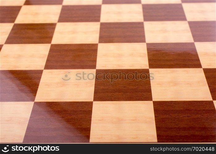 Chequered white and brown chess board in the view