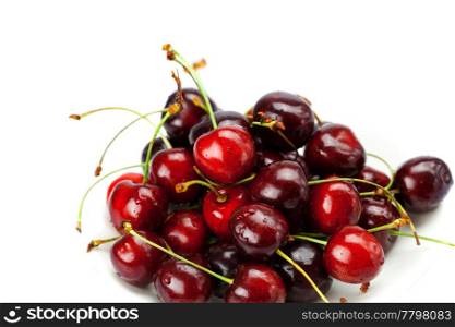 Cherries in a saucer isolated on white
