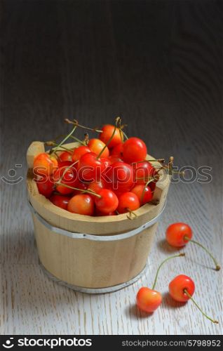 Cherries in a small wood bucket