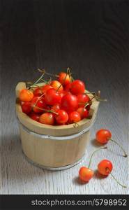 Cherries in a small wood bucket