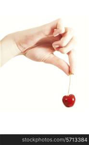cherries in the women&rsquo;s hand isolated on white background