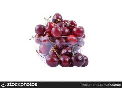 cherries on glass cup isolated on white background