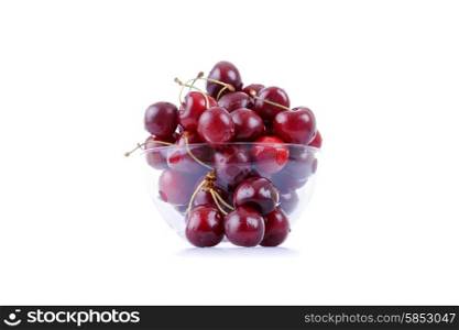cherries on glass cup isolated on white background